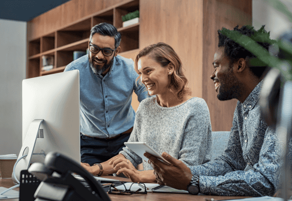 business professionals looking at computer
